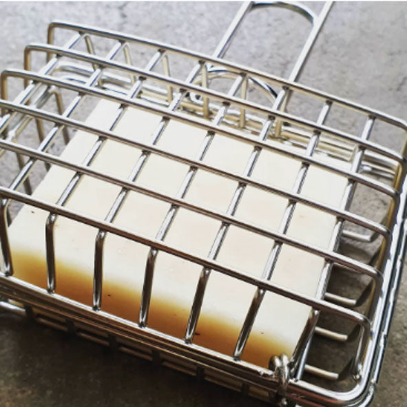 reusable soap cage closed with a dishwashing soap bar inside