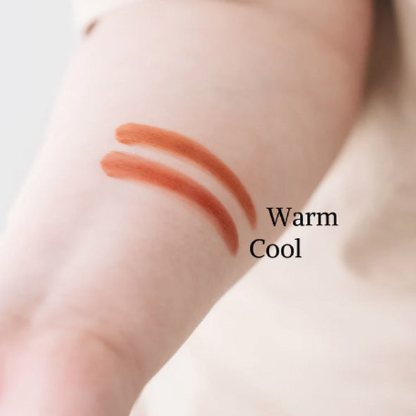 Two different tones of blush, warm and cool on a woman's arm