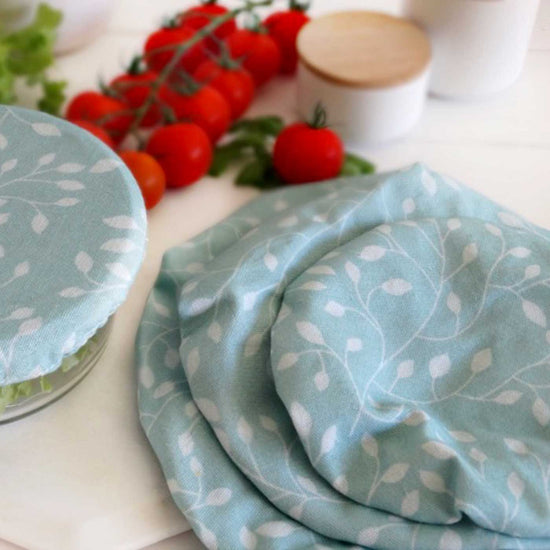 Set of 3 eco-friendly reusable food covers, plus one covering a left over salad. Diminish.