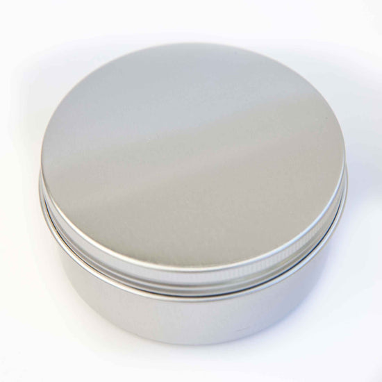Load image into Gallery viewer, Close up shot of round aluminium reusable travel tin.
