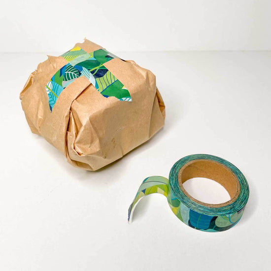 Present wrapped with washi tape and opened roll of the tape.