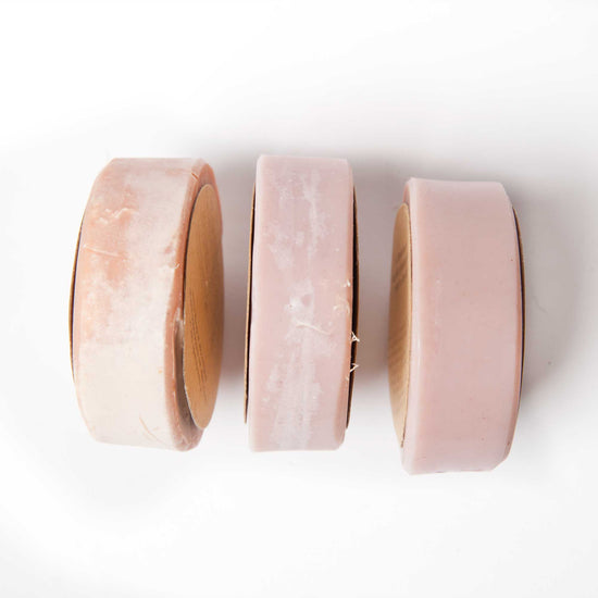 Load image into Gallery viewer, 3 bars of zero waste, vegan and handmade scrub soap. Peach in colour, sitting on their side and looking from above. On a white background.
