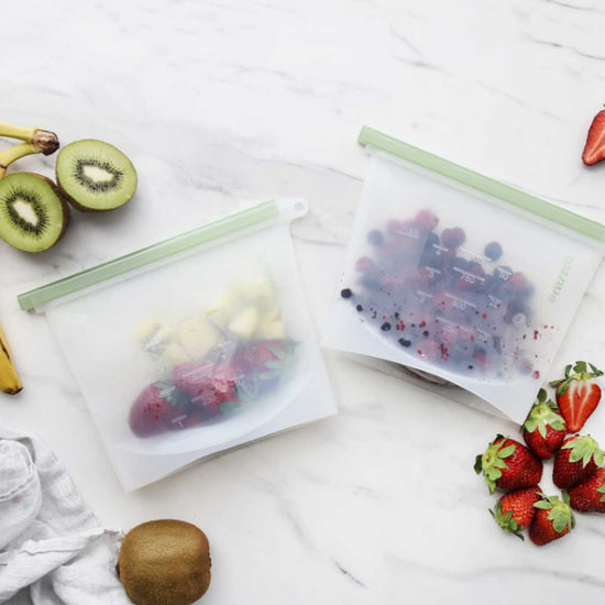 2 reusable silicone food pouches holding fruit inside. Adelaide Eco Shop.