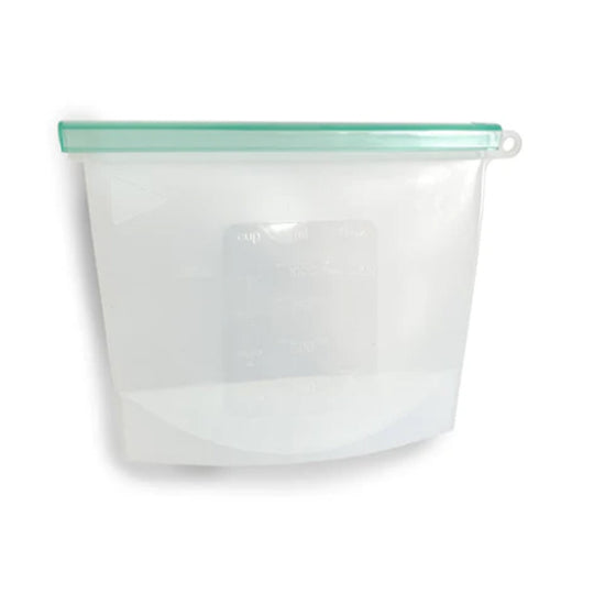 Reusable silicone food pouch with green seal lid. Diminish.