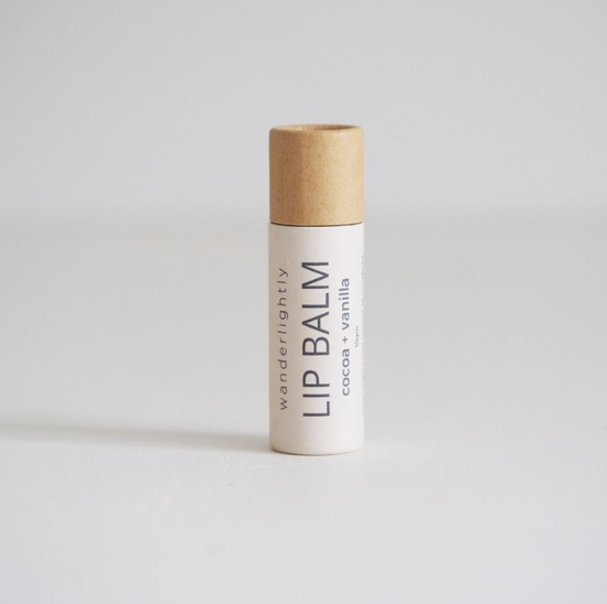 Load image into Gallery viewer, 1 cardboard tube of wanderlightly all natural cocoa vanilla lip balm
