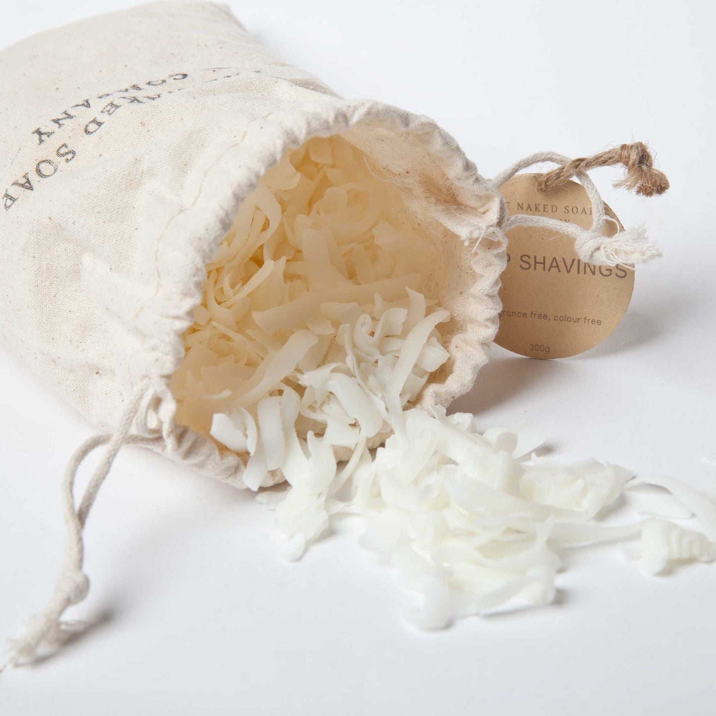 Cotton Canvas bag of scattered all natural soap shavings.