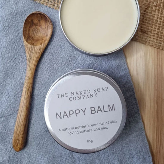 Load image into Gallery viewer, The naked soap company all natural and plastic-free nappy balm. Opened tup with a bamboo spoon.
