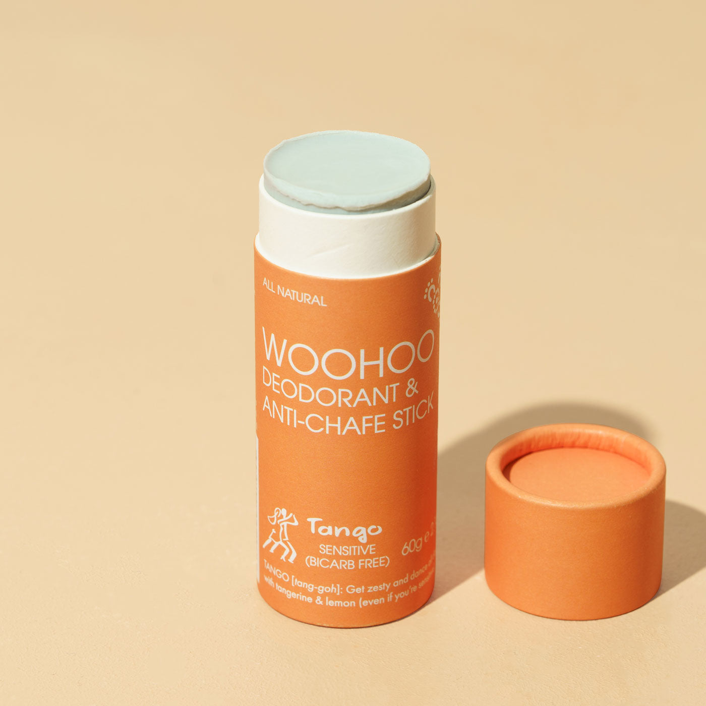Bar of opened cardboard tube of Woohoo Body's all natural and plastic free deodorant and anti chafe stick. Tango. 