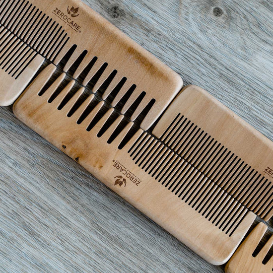 4 zerocare sustainable haircare detangler bamboo combs lined up on a benchtop