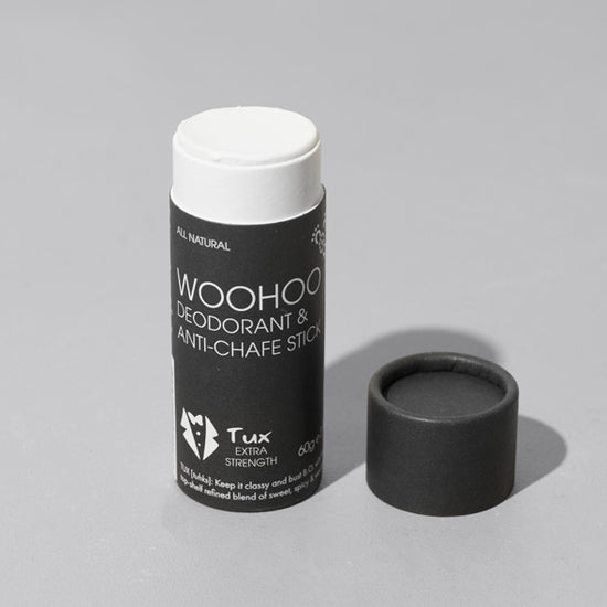 open tube of woohoo body zero waste deodorant and anti-chafe stick. On a white background.