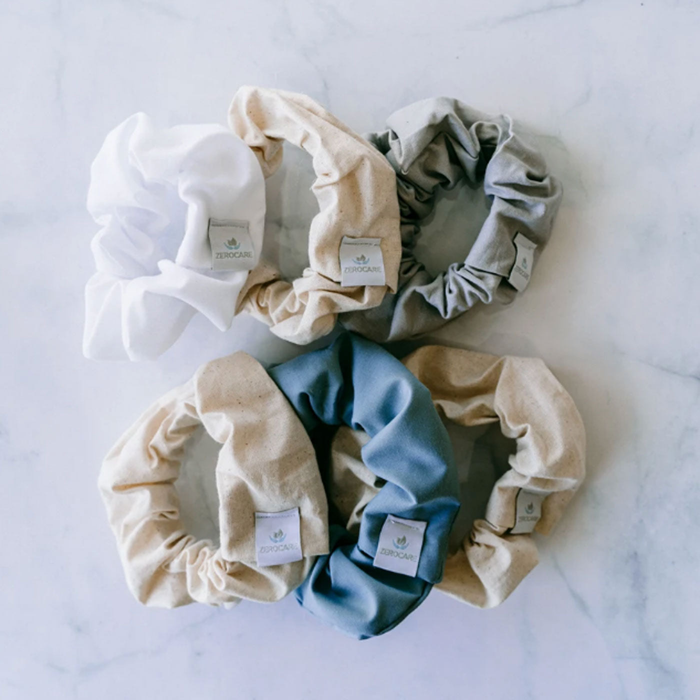 Set of 5 plastic-free eco scrunchies. White, tan, blue and grey. Diminish.
